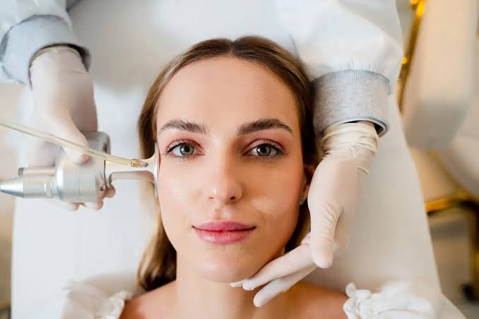Woman receiving CO2 CoolPeel laser resurfacing treatment at Yeppeun Skin Clinic in Jumeirah 2, Dubai