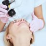 Licensed provider performing CO2 fractional laser treatment on patient’s face at Yeppeun Skin Clinic Dubai