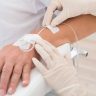 Patient receiving a Glow-Up IV glutathione antioxidant drip at Yeppeun Skin Clinic in Jumeirah 2, Dubai
