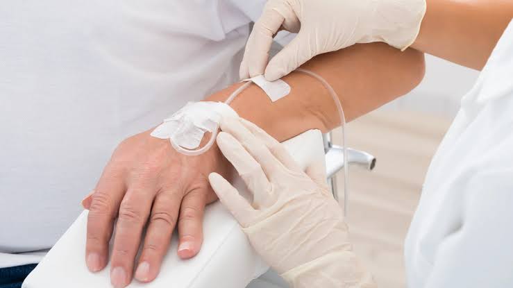 Patient receiving a Glow-Up IV glutathione antioxidant drip at Yeppeun Skin Clinic in Jumeirah 2, Dubai