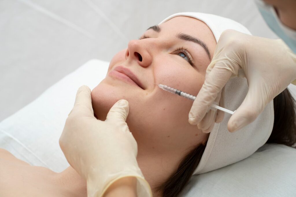 Licensed clinician performing PLLA Booster collagen-stimulating injectable treatment at Yeppeun Skin Clinic in Jumeirah 2, Dubai