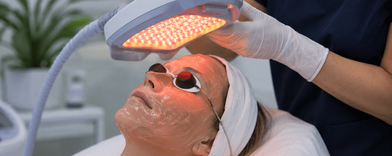 Woman receiving Photodynamic Therapy (PDT) light treatment for acne at Yeppeun Skin Clinic in Jumeirah 2, Dubai